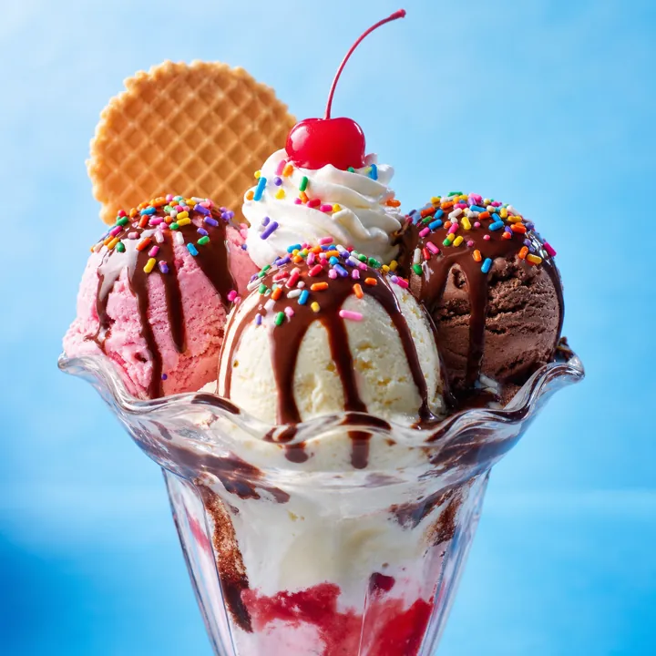 Three-scoop ice cream sundae with sprinkles